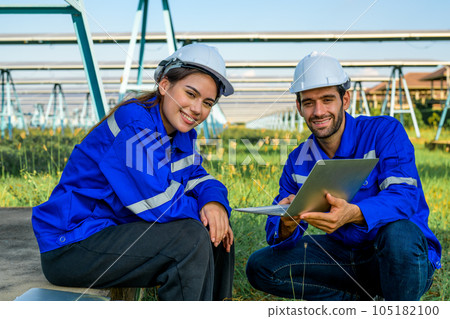 Workers installing solar panels, Engineer team at solar panel farm Workers installing solar panels, Engineer team at solar panel farm 105182100