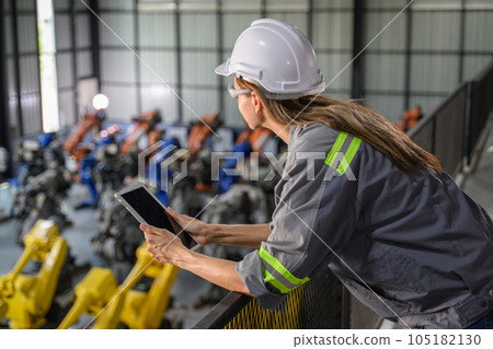 Maintenance engineer worker working with robotic machine automation 105182130