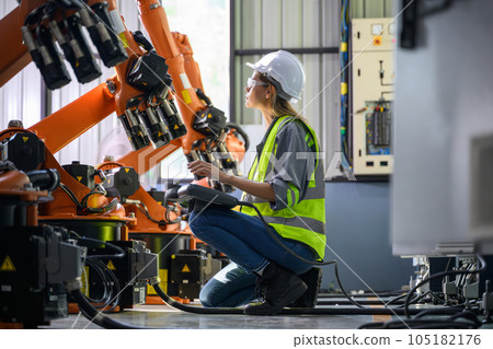 Maintenance engineer worker working with robotic machine automation Maintenance engineer worker working with robotic machine automation 105182176