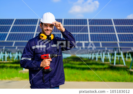 Engineer worker portrait with solar panel at solar farm 105183012