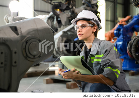 Maintenance engineer worker working with robotic machine automation Maintenance engineer worker working with robotic machine automation 105183312