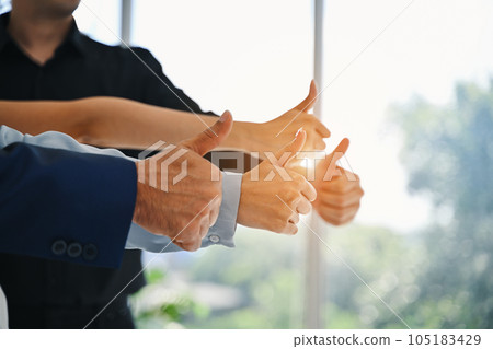 Successful gesture of employee team at office. New startup office. Meeting of employee startup company. High quality photo 105183429