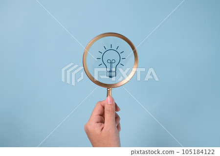 idea light bulb icon on magnifying glass. idea and new design concept on clean background. 105184122