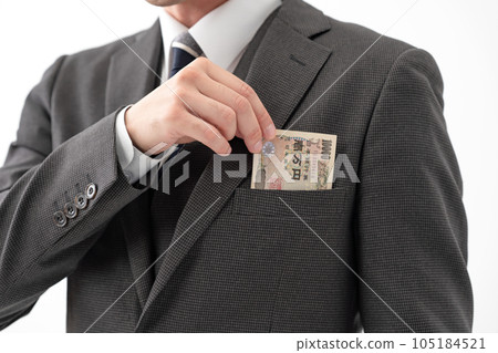 Businessman wad of bills Businessman wad of bills 105184521