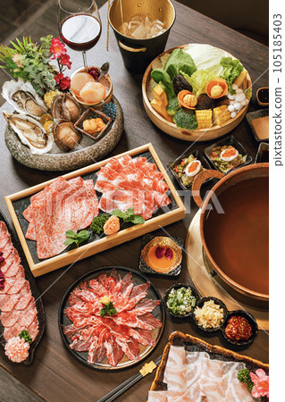 Seafood cuisine plate and beef sliced meat for hot pots. pork slices, scallops, seashells, oysters, caviar and other seafood delicacies. Seafood cuisine plate and beef sliced meat for hot pots. pork slices, scallops, seashells, oysters, caviar and other seafood delicacies. 105185403