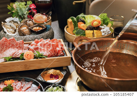 Seafood cuisine plate and beef sliced meat for hot pots. pork slices, scallops, seashells, oysters, caviar and other seafood delicacies. Seafood cuisine plate and beef sliced meat for hot pots. pork slices, scallops, seashells, oysters, caviar and other seafood delicacies. 105185407