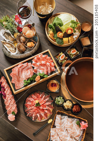 Seafood cuisine plate and beef sliced meat for hot pots. pork slices, scallops,  seashells, oysters, caviar and other seafood delicacies. 105185408