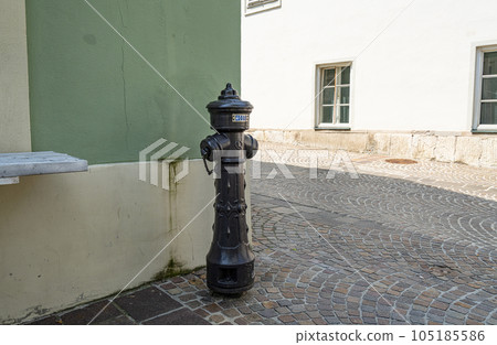 A fire hydrant on the sidewalk 105185586