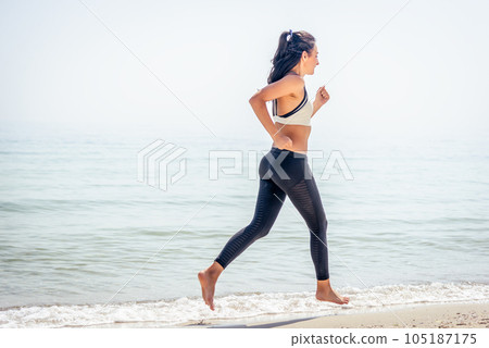 Fitness Girl running on the beach Fitness Girl running on the beach 105187175