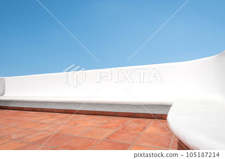 white bench on terrace with blue sky background,  summer house outdoor area 105187214