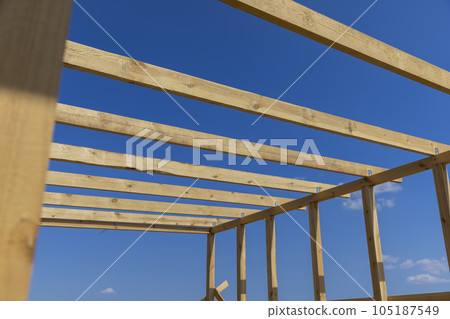 wooden beams used during the construction of the frame of the building wooden beams used during the construction of the frame of the building 105187549