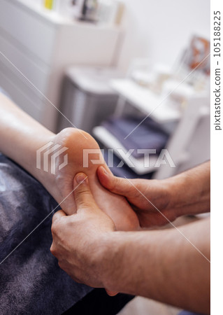 Close up of female foot getting gentle massage.  105188225