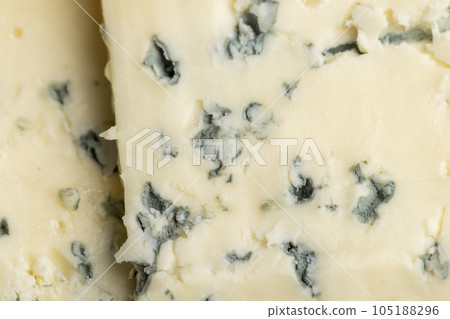 Cheese with blue mold cut into pieces 105188296