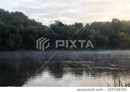 A little fog on the river in autumn 105188305