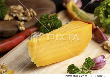 Sliced hard cheese made from milk 105188322