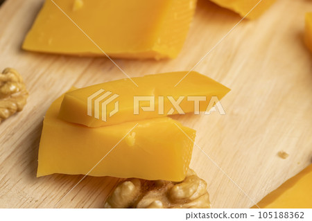 Sliced hard cheese made from milk Sliced hard cheese made from milk 105188362