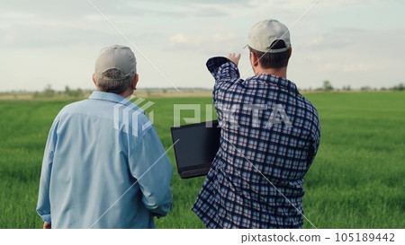 farmer laptop work, business partner, green wheat field, agricultural industry, corn field, male farmer work, agribusiness digital technology, farmer computer, corn field summer, working farmer farmer laptop work, business partner, green wheat field, agricultural industry, corn field, male farmer work, agribusiness digital technology, farmer computer, corn field summer, working farmer 105189442