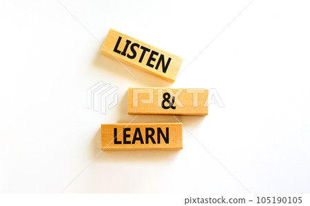 Listen and learn symbol. Concept words Listen and learn on wooden blocks. Beautiful white table white background. Copy space. Business, educational and listen and learn concept. Listen and learn symbol. Concept words Listen and learn on wooden blocks. Beautiful white table white background. Copy space. Business, educational and listen and learn concept. 105190105