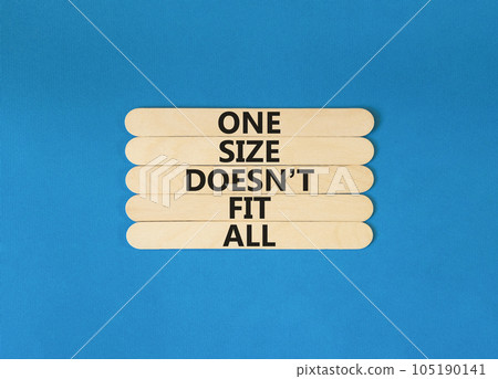 One size does not fit all symbol. Concept words One size does not fit all on wooden stick. Beautiful blue table blue background. One size does not fit all business concept. Copy space. 105190141