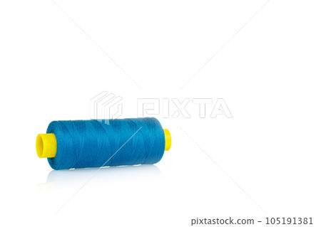 a skein of threads of blue color macro on a white background close up a skein of threads of blue color macro on a white background close up 105191381