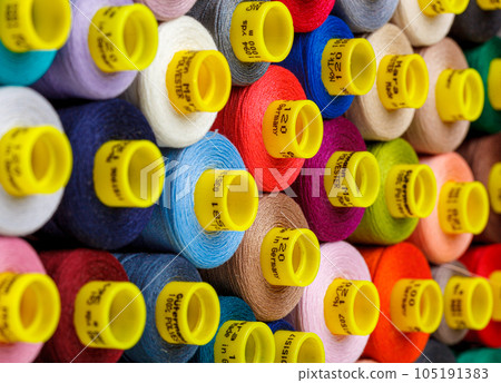 set of multi-colored spools of thread for sewing set of multi-colored spools of thread for sewing 105191383