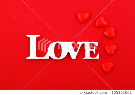 inscription love and red hearts on a red background 105191601
