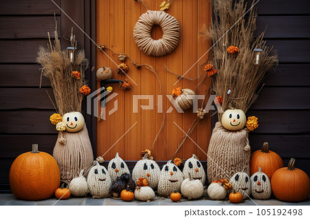 Knitted colorful pumpkins at halloween decorated front door. Generative AI 105192498