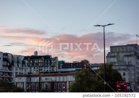 The cityscape of London at twilight The cityscape with historic buildings and double-decker buses The cityscape of London at twilight The cityscape with historic buildings and double-decker buses 105192572