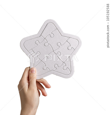 Hand holding star shaped puzzle isolated on white background. Clients ranking, customers rating, feedback concept 105192588