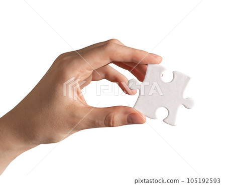 Hand holding single piece of puzzle isolated on white background Hand holding single piece of puzzle isolated on white background 105192593