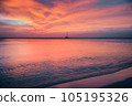 Palm Beach on Aruba island in the Caribbean Sea at dramatic sunset, Dutch Antilles 105195326