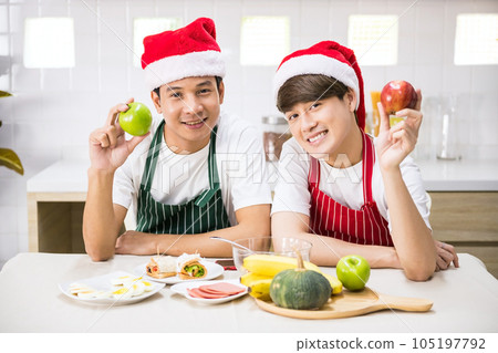 Portrait of lgbt Asian young gay couple in Santa hat celebrate xmas Portrait of lgbt Asian young gay couple in Santa hat celebrate xmas 105197792
