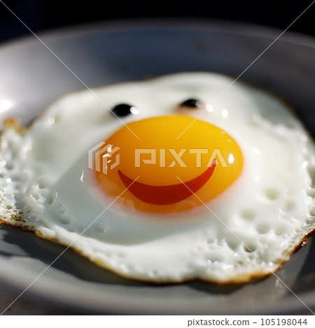 Smiling fried egg, yolk smile, appetizing breakfast, cheerful food background 105198044