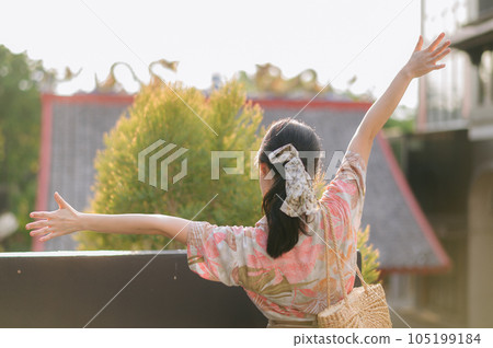 Portrait beautiful young asian woman on summer holiday vacation trip in Thailand. Young hipster female tourist sightseeing summer urban Bangkok destination. Asia summer tourism concept. Portrait beautiful young asian woman on summer holiday vacation trip in Thailand. Young hipster female tourist sightseeing summer urban Bangkok destination. Asia summer tourism concept. 105199184