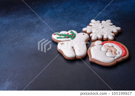 Beautiful festive Christmas gingerbread made by hand with decoration elements Beautiful festive Christmas gingerbread made by hand with decoration elements 105199927