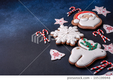Beautiful festive Christmas gingerbread made by hand with decoration elements Beautiful festive Christmas gingerbread made by hand with decoration elements 105199948