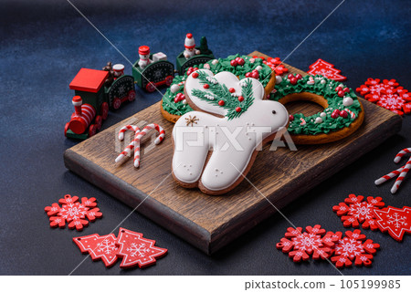 Beautiful festive Christmas gingerbread made by hand with decoration elements 105199985