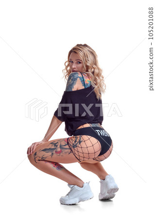 beautiful blonde girl in booty shorts and fishnet dancing twerk isolated on white background beautiful blonde girl in booty shorts and fishnet dancing twerk isolated on white background 105201088