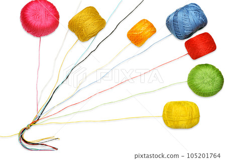 Multicolored knitting threads tied in a knot with a colorful yarn balls Multicolored knitting threads tied in a knot with a colorful yarn balls 105201764