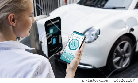 Smartphone display battery status interface by smart EV app. Peruse Smartphone display battery status interface by smart EV app. Peruse 105202197