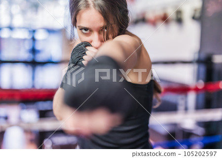 K1 mixed martial arts, Hispanic young woman fighter doing aerobox for cardio. Power strengh action K1 mixed martial arts, Hispanic young woman fighter doing aerobox for cardio. Power strengh action 105202597