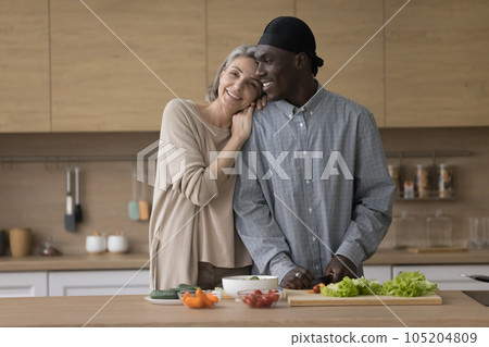Cheerful cute diverse mature couple keeping healthy lifestyle 105204809