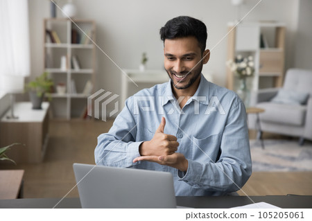 Positive sign language therapist speaking with gestures on video call Positive sign language therapist speaking with gestures on video call 105205061