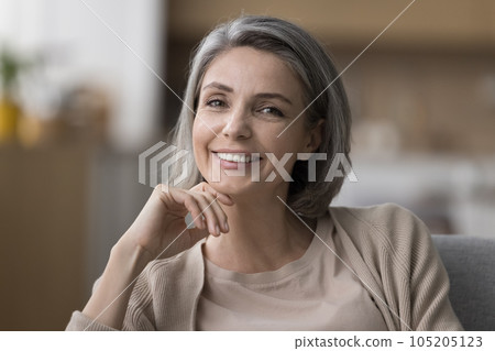 Happy beautiful mature woman indoor head shot portrait Happy beautiful mature woman indoor head shot portrait 105205123