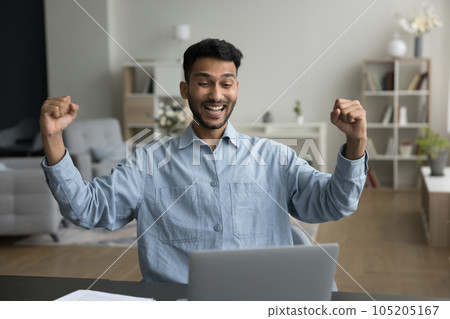 Happy excited winner guy celebrating achievement, success Happy excited winner guy celebrating achievement, success 105205167