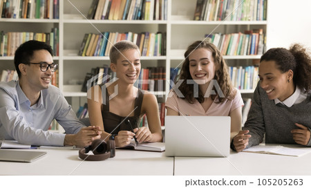 Happy multiethnic team of school students watching lecture on Internet Happy multiethnic team of school students watching lecture on Internet 105205263