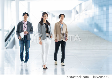 Young male and female engineers working in the office 105205469