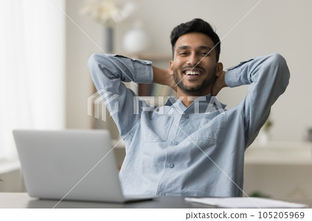 Portrait of happy successful young business man enjoying leisure 105205969