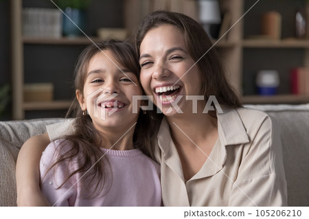 Cheerful mom hugging cute preschool kid girl looking at camera 105206210