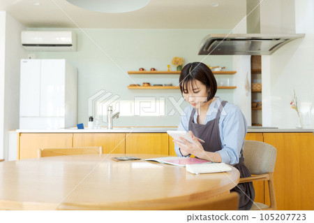 Woman counting bills Woman counting bills 105207723